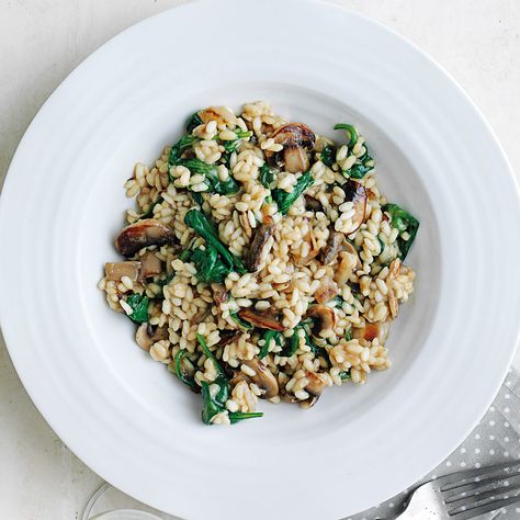 Looking to make a great meal without cooking a ton? Our Mushroom and spinach risotto recipe is perfectly portioned for one and simple to make. Spinach Risotto, Spinach And Mushroom, Mushroom Spinach, Vegetable Stock Cubes, Risotto Recipe, Mushroom Risotto, Risotto Recipes, Spinach Stuffed Mushrooms, Vegetable Stock