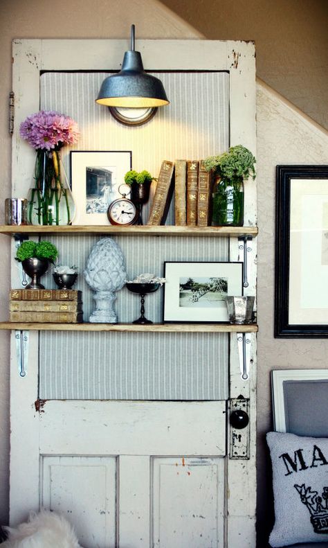 An upholstered backboard and industrial light fixture give this simple idea for extra shelving a stylish country look. Get the tutorial at Bulb to Blossom. Koti Diy, Doors Repurposed, Vintage Doors, Door Shelves, Deco Originale, Old Windows, Old Door, Old Doors, Vintage Door