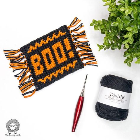 Looking for a fun and festive Halloween crochet mug rug pattern to display during the fall season? The Boo! Crochet Halloween Mug Rug pattern is a quick-to-make project that has zero ends to weave in! This tapestry crochet project uses only two different colours, making it a great way to practice colourwork crochet with ease. Makers will need to be familiar with changing colours, single crochet and working in the back loop only in order to complete this pattern. Crochet Mug Rugs Patterns Free, Boo Crochet, Crochet Mug Rug, Owl Crochet Pattern Free, Mug Rug Pattern, Halloween Rugs, Crochet Mug, Large Crochet Hooks, Mug Rug Patterns