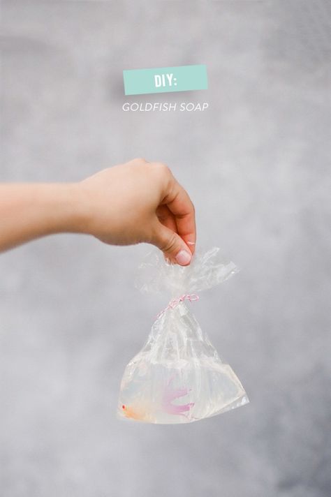 So now we're breaking down all of the DIYS for our State Fair Birthday party. I have to admit, we found this idea on Pinterest. Obviously. But really. There couldn't be a cuter, more appropriate favor. Tiny bags of goldfish surrounded by clear glycerin soap made to look exactly like the kind of prize you… State Fair Party, Outdoor Kids Party, Goldfish Party, Fish Soap, Soap Photography, Fish Birthday, Tiny Bags, Style Me Pretty Living, Diy Projects Gifts