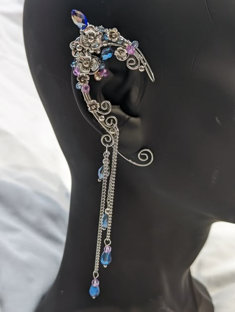 These elegant wrapped wire ear cuffs are size adjustable. Slip right over ear and then just shape the back wire to fit. Also, generally fits over other piercings. Made from aluminum and other alloy charms. Hobbit Clothes, Wire Ear Cuffs, Flower Wire, Anime Earrings, Angel Costume, Gothic Gifts, Elf Ears, Wrap Earrings, Gothic Wedding