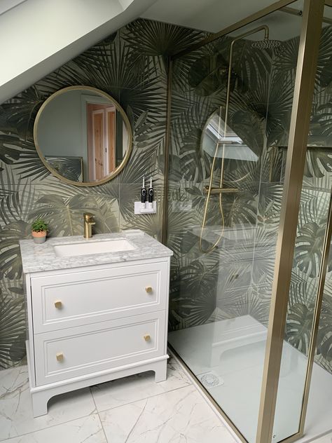 🌿Bathroom transformation into a tropical oasis with the Bonito jungle tiles.

➡️Product Codes
Bonito Jungle tiles >165470 
Kelto tiles > 110558
Ferris vanity unit >  151252
Vibra shower pack > 139057
Zena gold basin tap >  138965
Oscar toilet > 12725
Flush plate > 139296
Rosa radiator > 138776
In-wall toothbrush charger > 127686 
Amien shower screen >139943

#easybathrooms #BathroomInteriors #bathroominspo #bathroominspiration #interiordecorator #bathrom Jungle Theme Bathroom, Gold Rectangle Mirror, Bathroom Transformation, Renovation Inspiration, Tropical Oasis, Bathroom Inspo, Basin Taps, Simple Bathroom, Rectangle Mirror