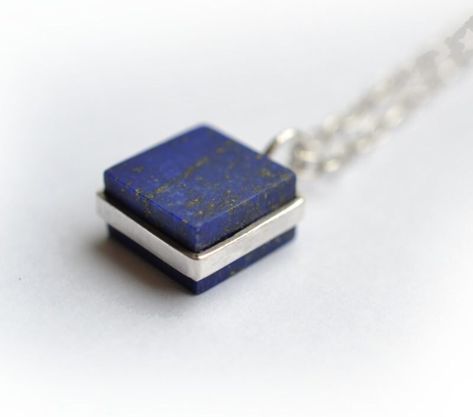 Square blocks of high quality lapis lazuli elegantly designed and set in 925 sterling silver. This chic necklace is designed by Maryam Omar and handcrafted by Afghan artisans in the old city of Kabul, Afghanistan. Make: 925 Sterling Silver Stone: Natural/undyed, earth-mined Lapis Lazuli Stone Size: 10x10mm Chain: 925 Sterling Silver Length of Chain: 48cm Or Make:  925 Sterling Silver Stone:  Black Marble 10x10mm Chain:  925 Sterling Silver Length of Chain:  48cm  Each piece of Zivarish Jewellery is placed in cotton pouch tied with a luxuries ribbon. Wear your jewellery or keep them in a dry place. Preferably in its pouch or a jewellery box. We advice not to keep your silver jewellery in open air as it will naturally tarnish with exposure to the air. Zivarish aims, selling jewellery that no Square Stone Pendant, Wax Carving Jewelry, Lapis Pendant, Lapis Necklace, Chic Necklace, Lapis Lazuli Necklace, Lapis Lazuli Stone, Jewelry Design Necklace, Sterling Silver Necklace Pendants