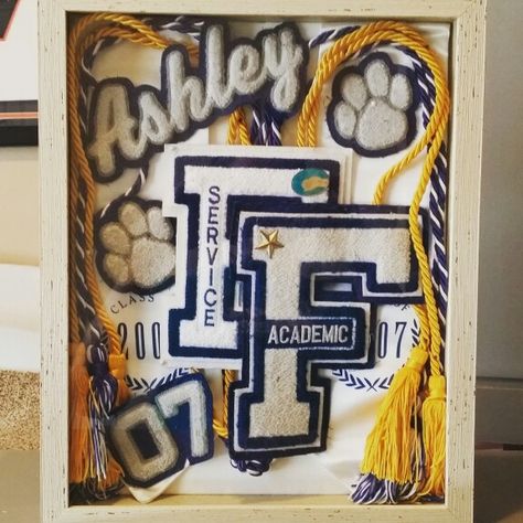 High school memorabilia shadow box. Letter jacket alternative Sports Shadow Boxes, Shadow Box Graduation, Cheer Box, Graduation Memories, Letter Jacket, Photo Frame Decoration, Senior Graduation Party, Varsity Letters, Graduation Party High