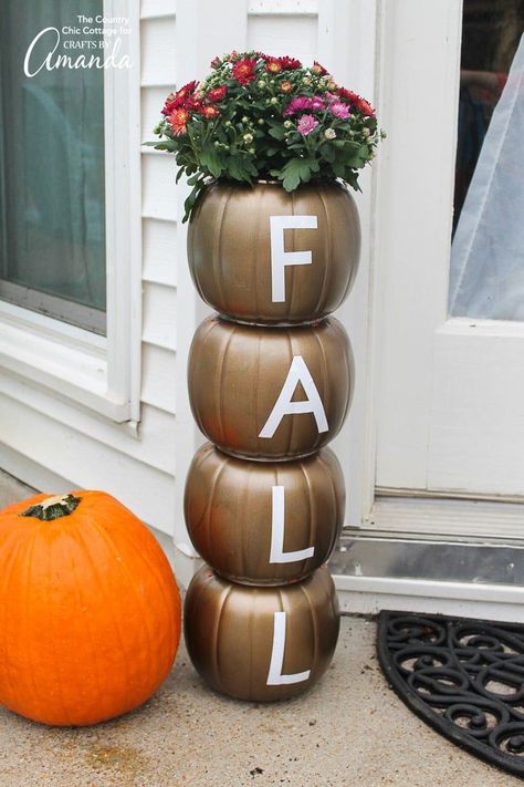 Easily make this stacked pumpkin planter using plastic pumpkins from the dollar store and some vinyl adhesive letters for a fun fall statement piece! #falldecor #pumpkin #dollarstorecrafts #mums #planter #gardening #fallcrafts #fall Pumpkin Porch Decor, Pumpkin Planter, Fall Decor Dollar Tree, Porch Pumpkins, Thanksgiving Decorations Diy, Plastic Pumpkins, Fall Planters, Adornos Halloween, Office Decorations