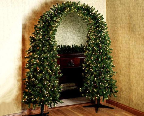 www.thegreenhead.com/2006/12/pre-lit-christmas | Pre-lit Christmas Tree Arch - The Green Head Christmas Tree Arch, Mantle Wreath, Unusual Christmas Trees, House Fireplace, Minimalist Tree, Amazing Christmas Trees, Photo Negative, Pre Lit Christmas Tree, Modern Christmas Decor