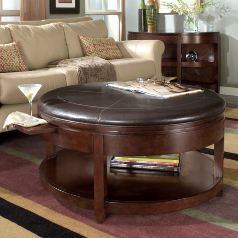 Magnussen T1096-45 Newark Wood Round Coffee Table - Liven up your living room with the convenience of this Magnussen T1096-45 Newark Wood Round Coffee Table doubling as a coffee table and a cocktail tab... Man Cave Coffee Table, Padded Coffee Table, Round Ottoman Coffee Table, Leather Ottoman Coffee Table, Round Leather Ottoman, Types Of Coffee Tables, Oversized Coffee Table, Storage Ottoman Coffee Table, Leather Coffee Table