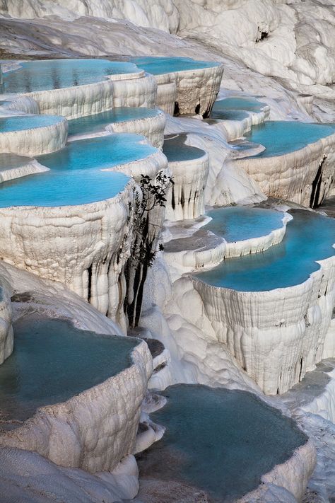 Pamukkale, meaning "cotton castle" in Turkish, is a natural site in Denizli Province in southwestern Turkey, which contains hot springs and travertines, terraces of carbonate minerals left by the flowing water. - Credit: Sylvain Sangla, via Flickr Pamukkale Turkey, Interesting Places, Snow And Ice, Incredible Places, Pretty Places, Places Around The World, Travel Around The World, Wonderful Places, Vacation Spots