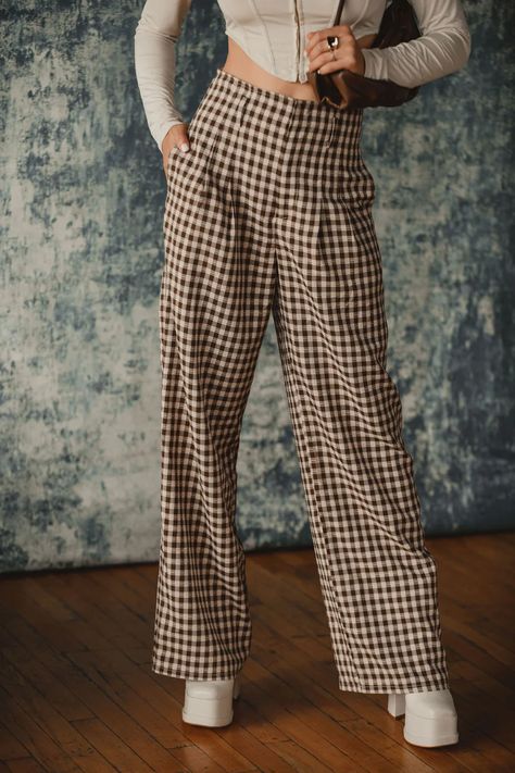 You are a trend setter in the Halley Brown Checkered Trousers. Made with everyone's favorite trouser fit and the perfect checkered print, these are THE pants you can't sleep on! Style with a corset top or a chunky sweater, you will be living in these trousers.  STYLE RECOMMENDATIONS: - pair with a cropped tank or a chu Checkered Trousers, Brown Checkered, 12th Tribe, Checkered Pants, Can't Sleep, Perfect Denim, Checked Trousers, Trendy Skirts, Checkered Print