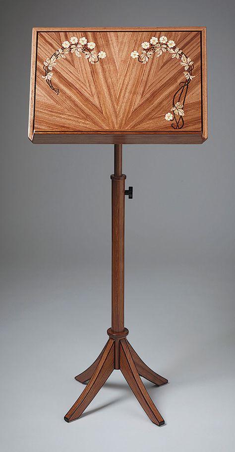 Bubinga Music Stand by Jerry Cousins — Cousins built this music stand as a gift to thank the San Francisco Bay Area chamber music group that puts on a free festival in his rural community each year. “I present them with a music stand to be used for the group, given to a musician, or auctioned as a fundraiser.”  Bubinga, ebony, and wenge 20-1/2W X 44H From FWW 247 Wooden Music Stand, Sheet Music Stand, Ukulele Chords Songs, Rural Community, Music Stands, Bedroom Redesign, Guitar Hanger, Ribbon Embroidery Tutorial, Chamber Music