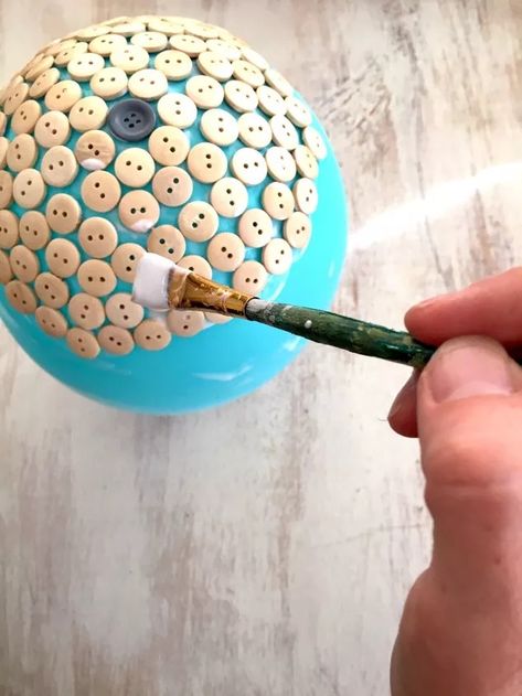 If you're looking for a fun button bowl project, this is one to add to your list. It's super inexpensive, really easy to make, and the result is so cute! All you need is a balloon, glue and some buttons to get started. #diy #button #glue #balloon #bowl Button Bowls How To Make A, Resin Buttons Diy, Moms Are Like Buttons Craft, Cute As A Button Ornament, Air Dry Clay Buttons Diy, Button Bowl, Cleaning Paint Brushes, Blowing Up Balloons, Best Glue