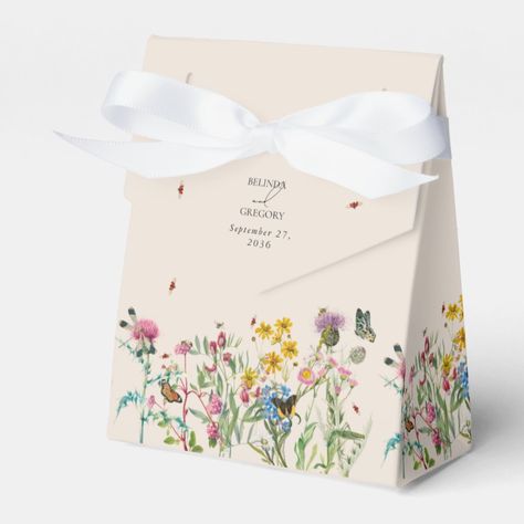 A beautiful watercolor wedding design featuring wildflowers and insects. A colorful arrangement of wild flowers and ladybugs, dragonfly, bees, grasshopper, butterflies in a wild floral spring garden. A unique design for anyone who loves colorful insects, watercolor florals, wildflower illustrations and botanical themed wedding stationery. An elegant ivory cream wedding favor box design with modern elements. Matching wedding invitations and other stationery items are also available. Garden Theme Bridesmaid Proposal, Insects Watercolor, Flower Garden Illustration, Butterfly Packaging, Blossom Logo, Colorful Insects, Floral Packaging, Wedding Graphic Design, Floral Graphic Design