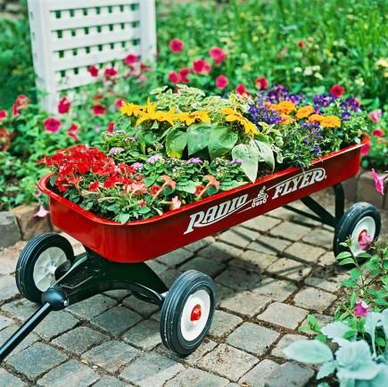 25 Creative Garden Containers | Midwest Living Planting A Rainbow, Wagon Planter, Garden Wagon, Portable Garden, Early Spring Flowers, Rectangular Planters, Garden Containers, Container Flowers, Pretty Plants