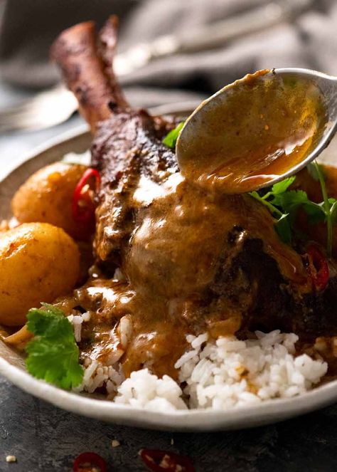 Pouring Massaman Curry over slow cooked lamb shanks Lamb Balls, Lamb Massaman Curry, Rendang Curry, Curry Lamb, Tin Eats, Slow Cooked Lamb Shanks, Green Curry Sauce, Lamb Shank Recipe, Slow Cooker Lamb