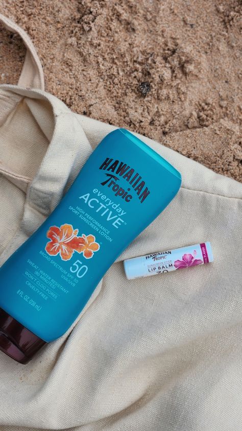 Hawaiian tropic sunscreen and lipbalm on a tote bag, on the sand at the beach Hawaiian Tropic Aesthetic, Lipbalm Aesthetic, Aesthetic Lip Balm, Hawaiian Tropic Sunscreen, Sunscreen Aesthetic, Beach Sunscreen, Lip Balm Stick, Beach Inspo, Sunscreen Stick