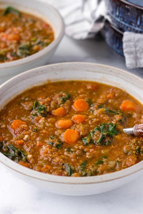 Upgrade your lentil soup game with this flavorful Lentil Kale Soup! Loaded with aromatic spices, hearty lentils, and nutritious kale and carrots, it's perfect for a nourishing meal. This lentil soup is meal prep and freezer friendly. Lentil And Cabbage Soup, December Meals, Lentil Kale Soup, Lentil Kale, Ham And Lentil Soup, Carrot And Lentil Soup, Kale Soup, Seasonal Produce, Inflammatory Diet