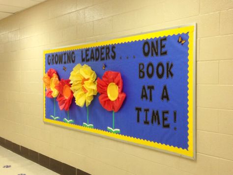 Growing Leaders. . .One Book at a Time! Bulletin Board Leader in Me South Green Elementary Library; Paper plate and tissue paper flowers with stems sprouting from open books Growing Leaders Bulletin Board, Readers Are Leaders Bulletin Board, Growing Readers Bulletin Board, Book Bulletin Board, Library Decorations, Flowers With Stems, School Hallway, Library Bulletin Board, Reading Boards