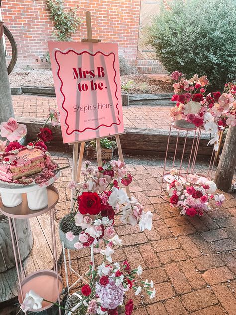 Pink and Red Theme Bachelorette Long Lunch Bridal Shower Themes Valentines Day, Bachelorette Brunch Picnic, Floral Hen Party Theme, Love Themed Bridal Shower Ideas, Showered With Love Bridal Shower Theme, Heart Themed Bachelorette Party, Pink And Red Engagement Party, Bridal Shower Ideas Valentines Day, Valentine’s Day Bridal Shower Ideas