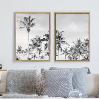 Reminisce about warm breezes, palm trees, and coastal beachscapes with this beautiful set of art. Framed in the USA in Waunakee, Wisconsin, this floating canvas art will be a pleasure to look at every day in your living room, bedroom, nursery, or any room in the home. Printed on gallery-wrapped canvas and framed with a lightweight polystyrene frame, this wall art has two hangers already attached to the MDF back for easy wall display. | Bay Isle Home™ Coastal Coconut Palm Tree Beach BW Left & Coa Palm Tree Beach, Coconut Palm Tree, Palm Trees Beach, Apartment Art, Coastal Painting, Beach Frame, Coconut Palm, Framed Photographs, White Wall Art