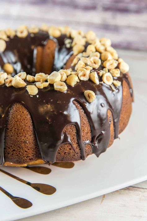 Nutella Bundt Cake: an easy buttery vanilla cake with swirls of nutella and a decadent chocolate nutella glaze. Perfect for birthdays and celebrations! #bunsenburnerbakery #bundtcake #nutellacake #nutella