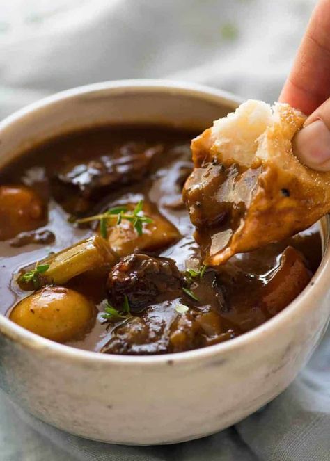 Close up photo of a piece of bread being dunked into Beef Stew with Potatoes and Carrots. The bread shows how thick the gravy sauce is./ Beef Stew With Potatoes, Beef Stew Dinner, Stew With Potatoes, Beef Stews, Cozy Soups, Comfy Food, Beef And Potato Stew, Classic Beef Stew, Grandma's Recipes