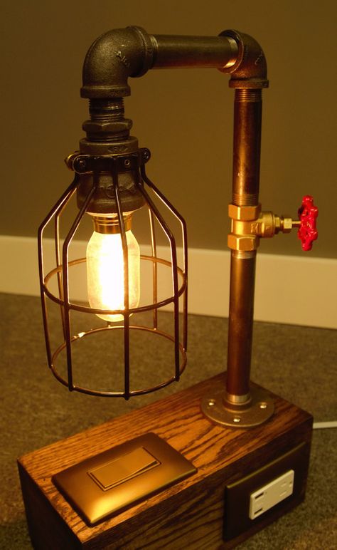 Industrial lamp with light switch, plugs, and USB ports from HomeProsPlus Lampe Steampunk, Diy Table Lamp, Diy Lampe, Industrial Table Lamp, Pipe Lighting, Industrial Design Furniture, Stained Oak, Vintage Industrial Furniture, Pipe Furniture