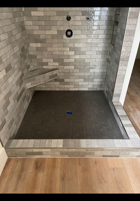 Gray 2 1/2” x 8” wall tile with silver grout Grey Shower Tile Ideas, Grey Shower Tile, Gray Bathroom Tile, Shower Floor Ideas, Silver Grout, Custom Showers, Gray Shower Tile, Gray Grout, Gray Tile