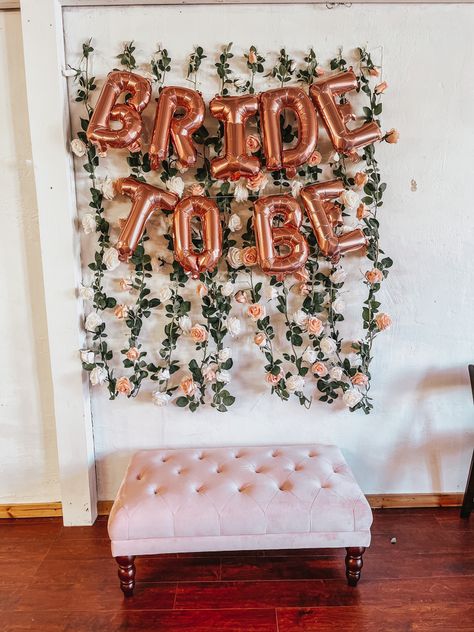 Diy Bridal Shower Photo Backdrop, Photo Wall Bridal Shower Ideas, Bridal Shower Decorations Backdrop, Hen Party Photo Wall, Hens Party Photo Backdrop, Floral Bridal Shower Photo Backdrop, Simple Bridal Shower Photo Backdrop, Simple Floral Bridal Shower Decor, Photo Booth Bridal Shower Ideas