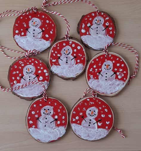 This wooden snowman ornament would be lovely to hang on the Christmas tree or in any room in the home to give it a festive feel, it could also be hung from a door or cupboard handle.  The wooden snowman decoration is painted red with a festive design in acrylics with a red and white string for hanging.  Product description *Acrylic paint on a circular wooden disc.  *Acrylic paint in red and white. *With a red and white string for hanging. *Ready to hand to decorate the Christmas tree or any room Christmas Wooden Discs, Painted Wooden Discs, Wooden Disk Ornaments, Wood Slice Ornament Kids, Handmade Christmas Ornaments For Kids, Wooden Christmas Ornaments Wood Slices, Wooden Disc Ornaments, Wood Slice Art Christmas, Home Made Christmas Decorations