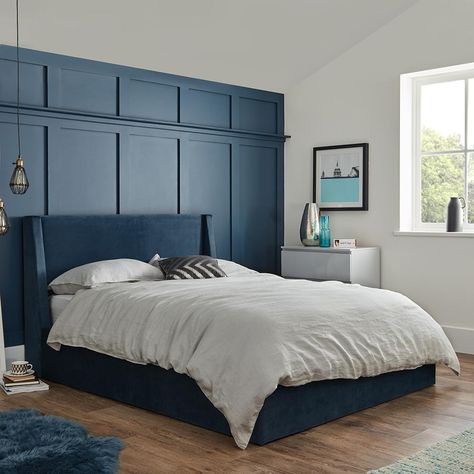 Blue velvet modern storage ottoman double bed frame - Laura James Blue Toddler Bed, Blue Bed Frame Bedroom Ideas, Jewel Coloured Bedroom, Blue Velvet Bed Frame, Blue Velvet Bedroom Ideas, Royal Blue Room, Bedroom Paneling, Royal Blue Bedroom, Royal Blue Bedrooms