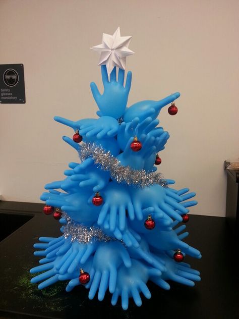 Medical glove tree I made in class today.  With help :) Medical Theme Christmas Tree, Medical Office Christmas Tree, Medical Christmas Tree, Medical Christmas Decorations, Medical Christmas, Hospital Decoration, Recycled Christmas Decorations, Pharmacy Decor, Christmas Units