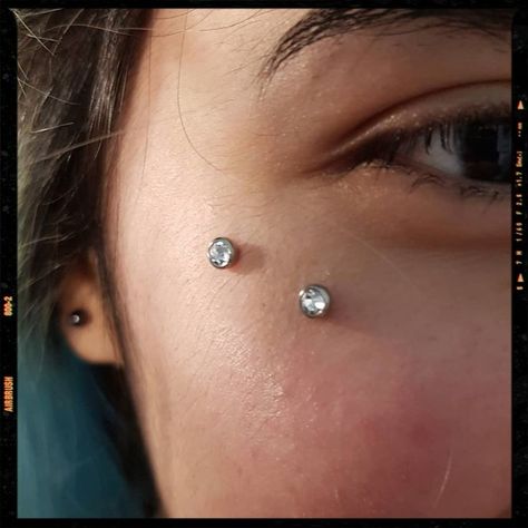 Surface Piercing | Surface piercing, Body jewelry piercing, Facial piercings Anti Eye Brow Piercing, Anti Eyebrow Piercing Dermal, Over Eyebrow Tattoo, Face Dermal Piercing Cheek, Anti Eyebrow Piercing Aesthetic, Piercing Under Eye, Cheek Bone Piercing, Surface Piercing Face, Cheekbone Piercing