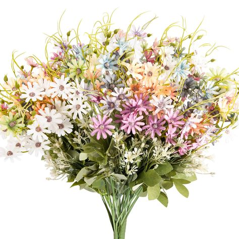 PRICES MAY VARY. Outdoor Artificial Flowers Bulk : Total in 6 assorted colors daisy artificial wildflower bouquets. 1 bundle each color, which have 6 floral stems and 18 flower heads. Size: each bunch is 15 inch in length, 1 package 6pcs are full in a small vase which 4" in diameter, 2 package 12 bunches are fitting nicely in a medium size pot which 8“ in diameter to made very big bouquet. UV Resistant Outdoor Silk Flowers: The muticolor daisy fake flowers with stems are made of silk, material e Faux Greenery Outdoor, Fall Room Decor, Garden Vases, Silk Plants, Wildflower Bouquet, Outdoor Wedding Decorations, Silk Flower, Faux Plants, Wild Flower