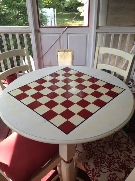 Turn a simple table into a game table.  I painted a checker/chess board on the top, and put two coats of polyurethane for the finish. Painted Chess Table, Rustic Game Tables, Painted Game Table, Checkers Table, Checkerboard Table, Obx Nc, Wood Chess Board, Paint Games, Diy Tv Stand