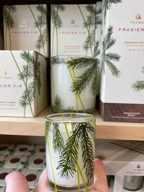 2 of the thymes candles, clear glass with pine needles. Votive size in hand, larger size behind on shelf. Thymes Frasier Fir, Gifts For Co Workers, Mothers Gifts, Frasier Fir, Holiday Candle, Wishlist 2024, Holiday Candles, Gift Guides, Housewarming Gifts