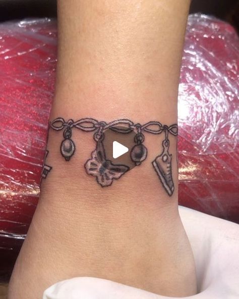 Daniel Baker on Instagram: "Charm bracelet tattoo" Charm Bracelet Tattoo For Women, Bracelet Tattoo Ideas, Charm Bracelet Tattoo, Feminine Tattoo Sleeves, Bracelet Tattoo, Stylish Tattoo, Tattoo Sleeves, Feminine Tattoo, Tattoo Bracelet