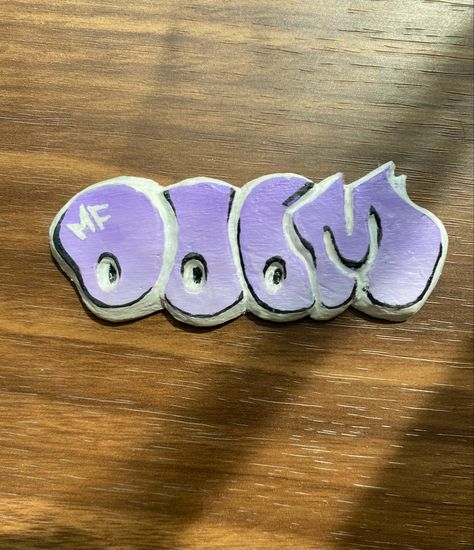 Clay sculpture, purple, logo, mf doom, creation, 3d Mf Doom Logo, Logo Purple, Clay Inspo, Graffiti Words, Mf Doom, Purple Ombre, Clay Creations, Shirt Ideas, Clay Art