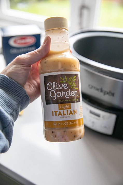 hand holding olive garden dressing