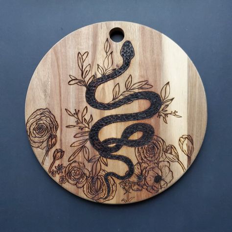 A functional and fully hand woodburned board with fun details. Check out my Instagram for more 🤎 #handmade Snake Wood Burning, Witches Woods, Snake Wood, Wood Burned Signs, Burning Wood, Christmas Ghost, Burning Love, Wood Burning Crafts, Wood Burning Art