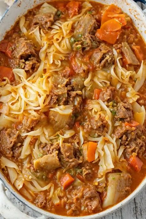 Cabbage Roll Soup Recipe

Ingredients

- 1 pound ground beef or turkey
- 1 small onion, chopped
- 3 cloves garlic, minced
- 1 can (15 ounces) diced tomatoes
- 1 can (15 ounces) tomato sauce
- 1 cup beef or vegetable broth
- 1 small head of cabbage, chopped
- 1 teaspoon dried thyme
- 1 teaspoon dried oregano
- Salt and pepper to taste
- 1/2 cup uncooked rice
- 1 tablespoon olive oil

Full Cooking Instructions on... Turkey Cabbage Soup, Cabbage Roll Soup Recipe, Easy Cabbage Rolls, Oregano Salt, Cabbage Roll Soup, Cabbage Roll, Soup With Ground Beef, Dried Thyme, Vegetable Broth