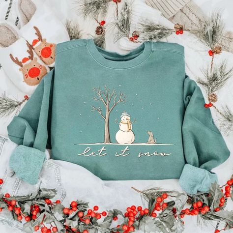 Get into the festive spirit with our Christmas Snowman Sweatshirt! Featuring a cute "Let It Snow" snowman design, this Winter Sweatshirt is perfect for celebrating the holiday season. Whether you're cozying up at home or heading out for a holiday event, this Christmas Crewneck will keep you warm and stylish. 
#christmas sweatshirt
#snowman sweatshirt
#let it snow shirt
#winter sweatshirt Womens Christmas Gift, Let It Snow Snowman, Snowman Shirt, Snowman Design, Christmas T Shirt Design, Womens Christmas, Christmas Tree Shirt, Christmas Crewneck, Tree Shirt