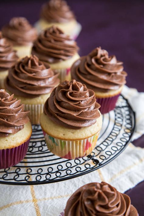 Soft and fluffy homemade vanilla cupcakes with chocolate frosting is a classic combo perfect for birthday celebration. Or pair this easy vanilla cupcake recipe from scratch with different frosting to create any flavor combo you want! #wildwildwhisk #cupcakes Classic Cupcake Recipe, Easy Vanilla Cupcake Recipe, Homemade Vanilla Cupcakes, Cupcakes With Chocolate Frosting, Easy Vanilla Cupcakes, Cupcake Recipes From Scratch, Chocolate Swiss Meringue Buttercream, Meringue Frosting, Vanilla Muffins