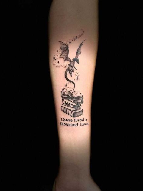 Tattoo Ideas For Bookworms, Dragon And Book Tattoo Ideas, Book Girl Tattoo Ideas, Book Magic Tattoo, Dragon Books Tattoo, Dragon Coming Out Of A Book Tattoo, Book And Dragon Tattoo Ideas, Book Tattoo With Dragon, Book Dragon Tattoo For Women