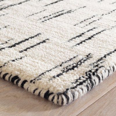 With a randomized light-to-dark gradient pattern, this refined luxury wool rug features a broken stripe effect reminiscent of ikat-dyed Japanese textiles. Created by skilled artisans using a loom with a warp and weft foundation upon which wool threads are hand-knotted for a durable, soft, and nubby pile. Rug Size: Runner 2'6" x 8' Dash and Albert Rugs Ozzie Hand Loom Knotted Wool Rug - Area Rugs in Black/White | Size Runner 2'6" x 8' | Perigold Gradient Pattern, Dash And Albert Rugs, Viscose Rug, Rug Guide, Abstract Hand, Dash And Albert, Wool Thread, Custom Size Rugs, Japanese Textiles