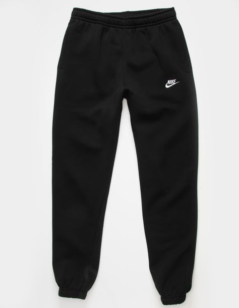 Nike Sportswear Club Fleece Sweatpants. Combines classic style with the soft comfort of fleece. Standard fit has a relaxed, easy feel. Tapered leg. Elastic waistband. Side pockets. Embroidered logo on left leg. Elastic cuffs. Fleece lining. 80% Cotton 20% Polyester. Machine wash. Imported. Nike For Women Clothes, Nike Oversized Sweatpants, Joggings Nike, Nike Wishlist, Nike Trackies, Nike Trousers, Black Nike Pants, Nike Hose, Ensemble Nike