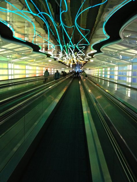 Chicago O'hare Airport, the colors of the lights change on the moving walkway and the eerie music calms you down before a flight... Airport Escalator, Ohare Airport, Moving Walkway, Manchester Airport Terminal 2, New York Public Transportation, Heathrow Airport Terminal 5, Aerial Tramway, Walkway, Chicago