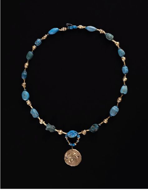 “This necklace has been strung with a variety of Egyptian amulets, including two tiny frog-shaped beads (the frog was connected to fertility and fecundity), wedjat eyes, cowrie shells, and one circular amulet inscribed with the sa symbol. The sa hieroglyph was the word for ‘protection.’ The gold pendant with a Medusa-like decoration is not pharaonic in date.” (Jennifer Wegner, label text, “Sacred Adornment: Jewelry as Belief in Ancient Egypt”) - Google Sacred Adornment, Egyptian Amulet, Label Text, Adornment Jewelry, Cowrie Shells, Cowrie Shell, Amulets, The Frog, Ancient Egypt