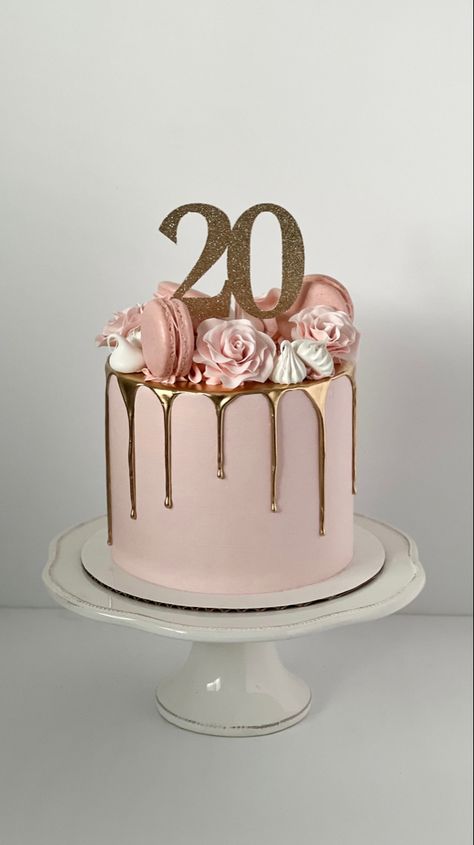 Pink cake with a gold drip. The top is decorated with pink sugar roses, pink macarons and white meringues. A sparkly, gold cake topper sits in the middle and reads “20”. Tårta Design, Modern Birthday Cakes, 20th Bday, 14th Birthday Cakes, Small Birthday Cakes, 20 Birthday Cake, 13 Birthday Cake, Cake With Flowers, 21st Cake