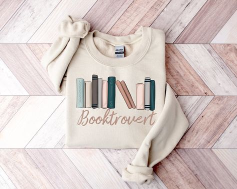 "Book Lover Christmas Gift, Book Shirt, Book Lover Tshirt, Gift for Book Lovers, Book Worm Tshirt, Book Club Shirt, Reading Shirt, Book Nerd ❤️Custom Prints, Endless Smiles! Express yourself with our made to order DTF print shirts.❤️  To create and order, follow these steps 🎈🎆 1. Review the listing photos to ensure you're aware of available colors and sizes 2. Select Size/Style: Choose your preferred size from the provided drop-down menu. 3. Choose color: Pick you desired color from the available options. 4. Select Quantity: Pick the quantity you wish to order 5. Add to Cart: Click the \"Add to Cart\" button to place your items in your shopping cart 6. Multiple Sizes: If you are purchasing multiple sizes, repeat steps 2 to 5 for each size individually, adding them to your cart one by one Book Nerd Shirts, Librarian Shirt, Gift For Book Lover, Lover Sweatshirt, Reading Shirts, Teacher Teacher, Sweatshirt Cute, Book Shirts, Club Shirts