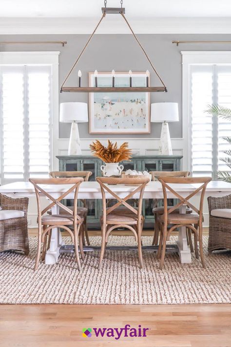 Dining room inspiration, right this way. Bring in woven seating, a jute area rug, beach-inspired wall art to make this look yours. Coastal Dinning Room, Coastal Farmhouse Dining Room, Beach Dining Room, Fall Dining Room, Coastal Dining Room, Coastal Dining, Autumn Dining, House Dining Room, Coastal House